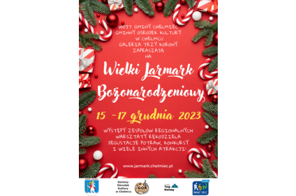 Plakat: na czerwonym tle po bokach gałązki jodły oraz ozdoby choinkowe, w środku tekst: Wójt Gminy Chełmiec Gminny Ośrodek Kultury w Chełmcu Galeria Trzy Korony Zapraszają na Wielki Jarmark Bożonarodzeniowy 15-17 grudnia 2023 Występy zespołów regionalnych,